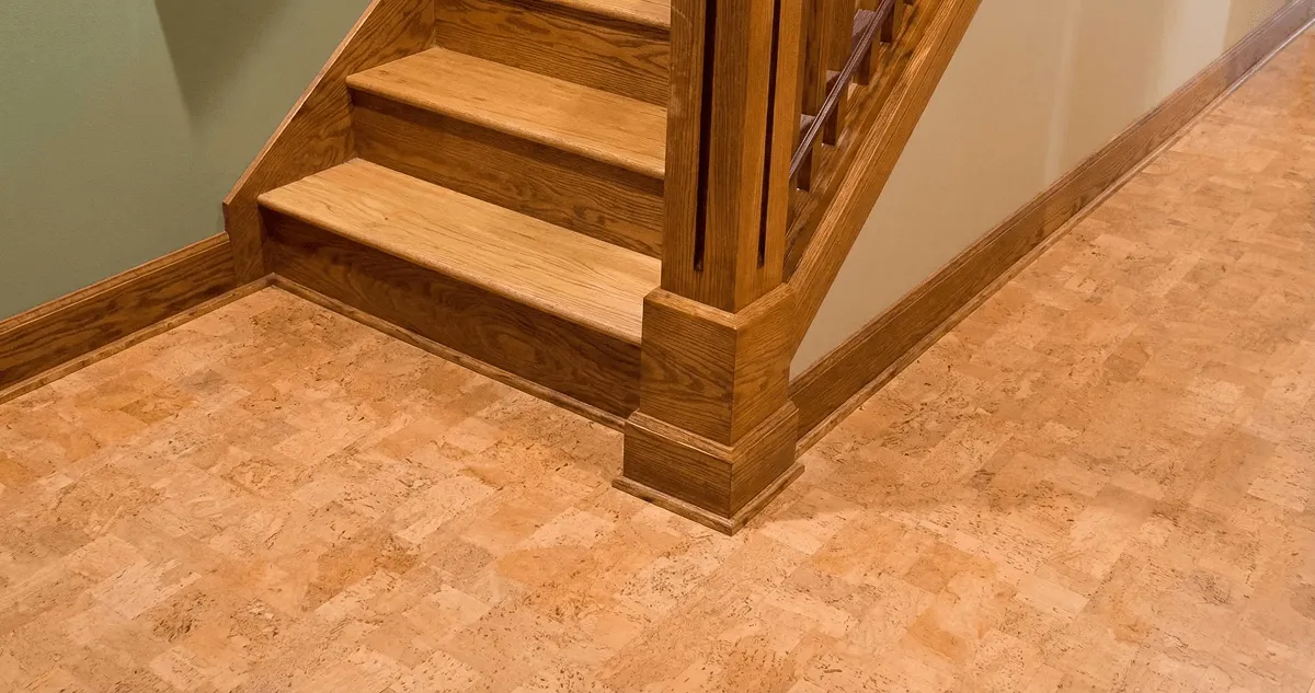 End of a staircase with cork flooring in Chicago, IL