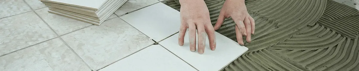 Professional installing white tile floors in Chicago, IL